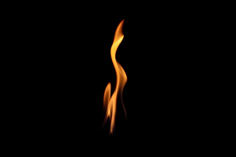 What Is That Burning Smell Coming From My Furnace? Photo of a flame with a dark background.